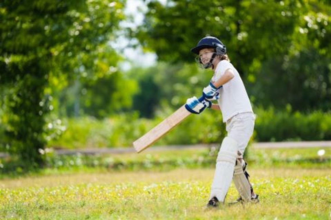 Young_child_batting_with_a_cricket_bat