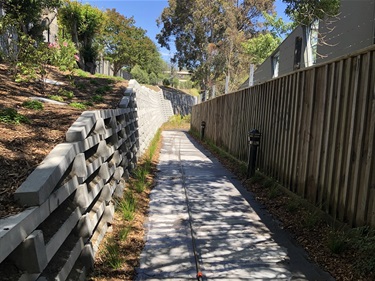 Wall and concrete path