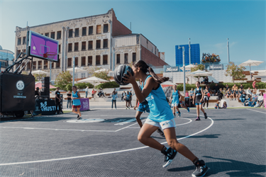 Youth playing basketball at Prahran Square