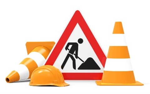 Signs of roadworks, triangle with man digging, witches hat, hard hat