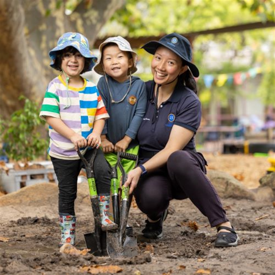 Princes_Close_Early_Years_educator_digging_in_garden_with_two_children 2023 (36).jpg