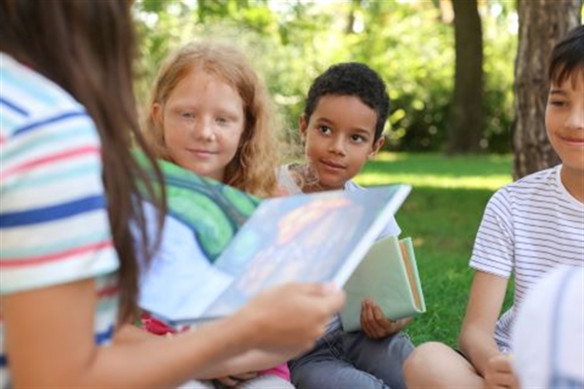 children-listening_to_stories_outdoors