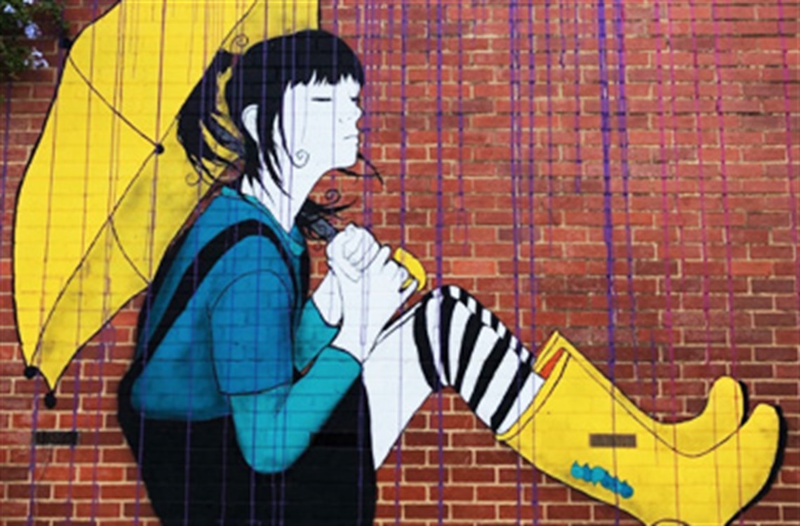 Section of the artwork: The older girl sits holding an umbrella in the rain as she looks pensive with closed eyes