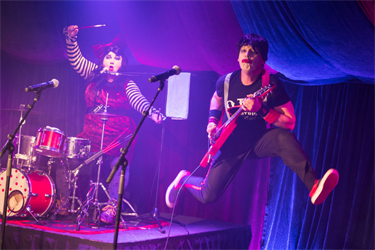 Two people performing on stage