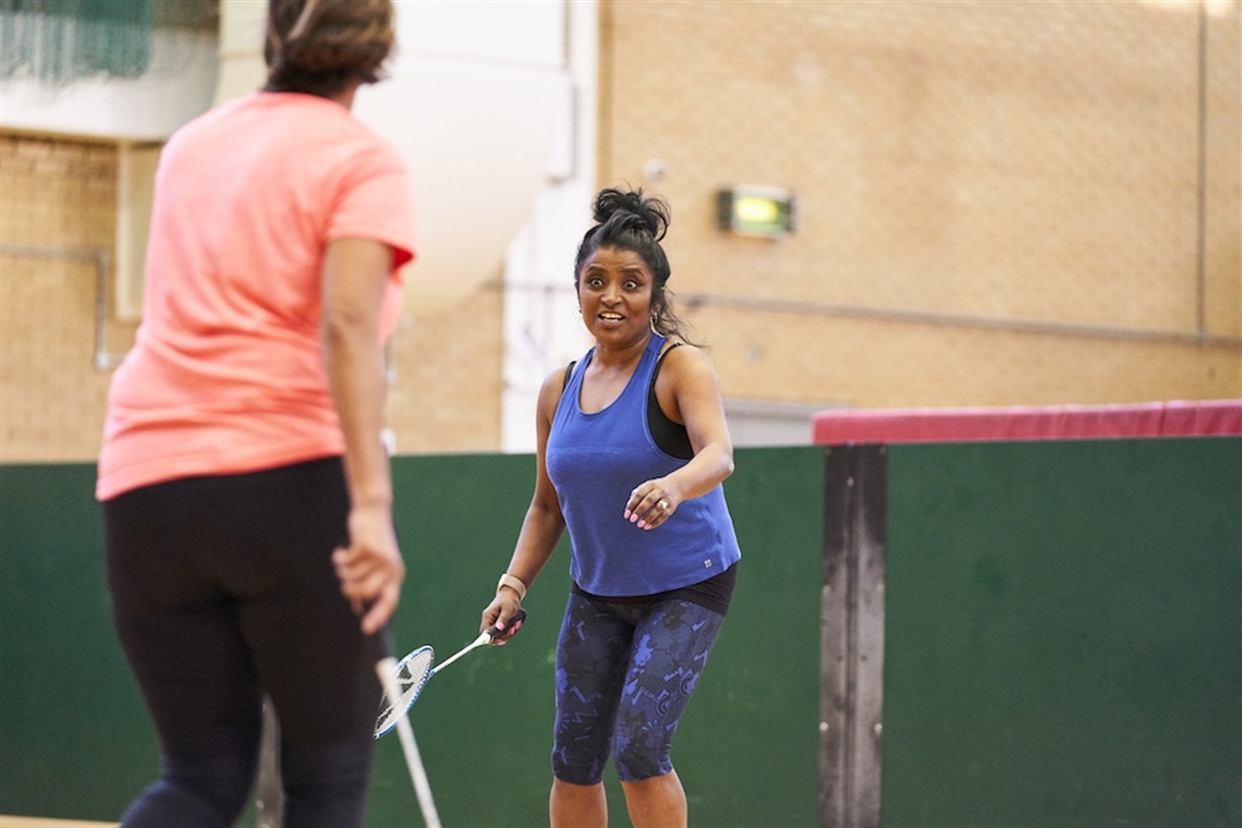 Two active women enjoying a game of squash